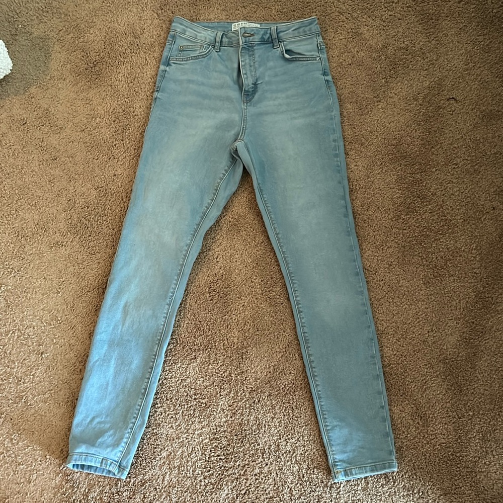 Light wash jeans “never worn”